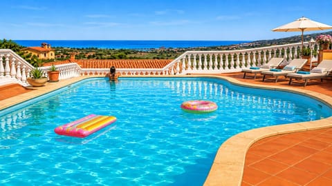 Seasonal outdoor pool, pool umbrellas, sun loungers
