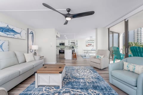 Living area into dining/kitchen with 3 separate balcony access areas