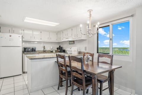 The dining room table comfortably seats four (4).