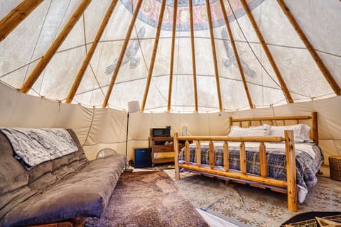 Spend the night in a king bed in an authentic tipi.