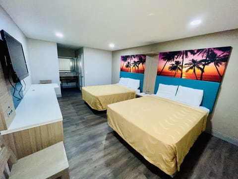 Standard Room, 2 Queen Beds | Desk, laptop workspace, free WiFi, bed sheets