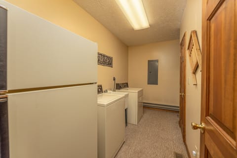 Laundry room with a fridge, washer, and dryer at Cubs' Crib, a 3 bedroom cabin rental located in Gatlinburg