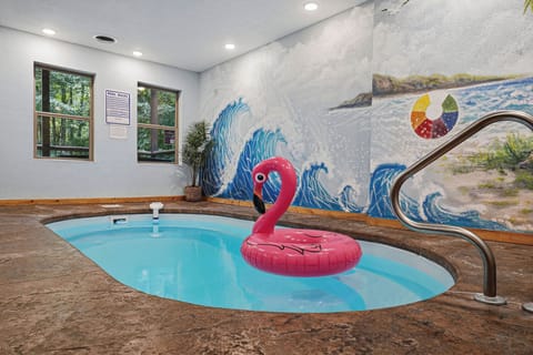 Dive into your private indoor pool, complete with whimsical beach-themed murals that transport you to coastal paradise, no matter the weather outside.
