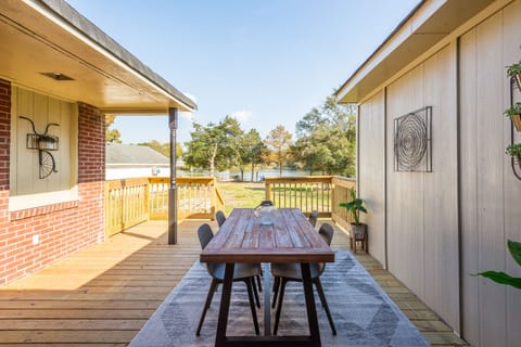 Spacious riverfront deck perfect for outdoor dining and sunset dinners.