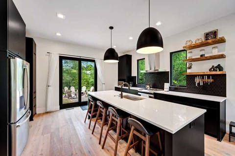 The chef's kitchen is a culinary haven, equipped with state-of-the-art appliances and an abundance of counter space for your gourmet creations.