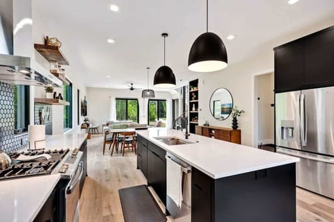 The chef's kitchen is a culinary haven, equipped with state-of-the-art appliances and an abundance of counter space for your gourmet creations.