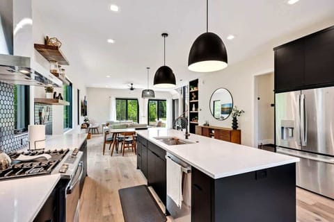 The chef's kitchen is a culinary haven, equipped with state-of-the-art appliances and an abundance of counter space for your gourmet creations.