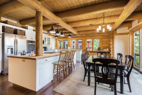 Spacious kitchen and dining area with rustic charm.