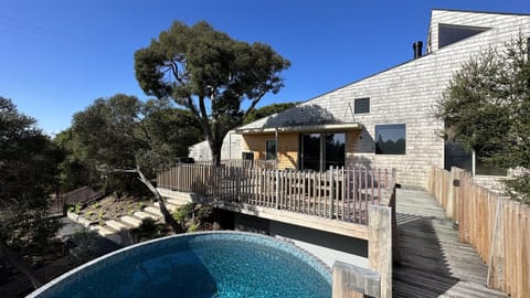 Main deck and swimming pool looking back at the house