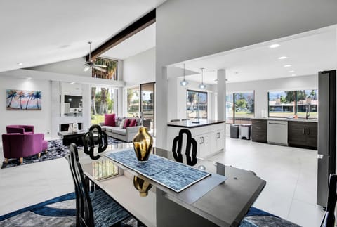 Spacious open-concept living, dining, and kitchen with vaulted ceilings