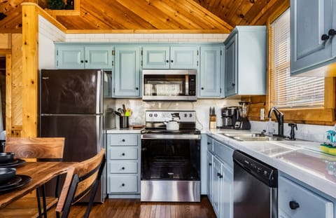 Renovated kitchen with new appliances and modern black finishes