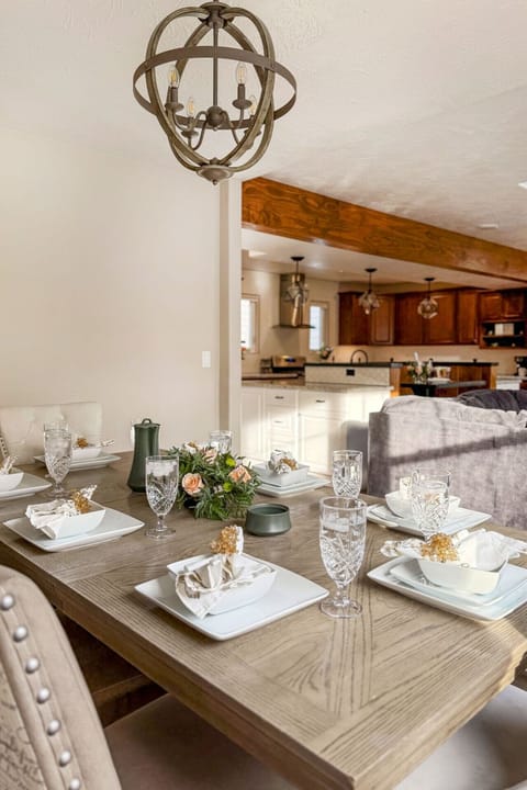 Farmhouse-style dining with elegant décor and seamless kitchen access.
