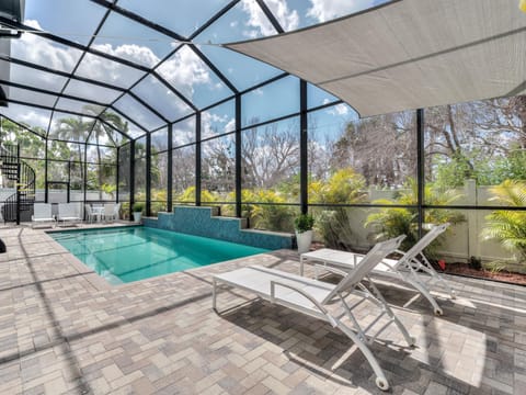 Large Heated Pool with ample seating and shaded areas