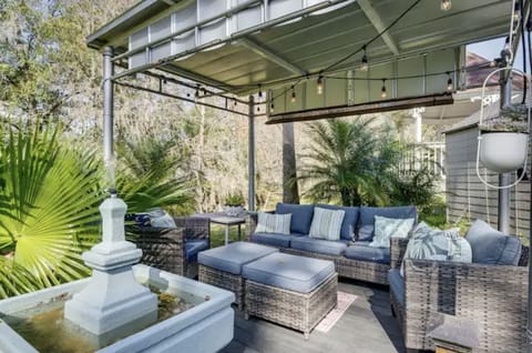 Outdoor sitting area with water fountain.
