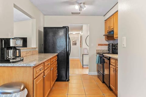 {KITCHEN} The spacious granite counter tops provide ample space for meal preparation, while the modern amenities ensure that cooking is a breeze. We've provided all the necessary kitchen amenities, so you can prepare and enjoy delicious meals.