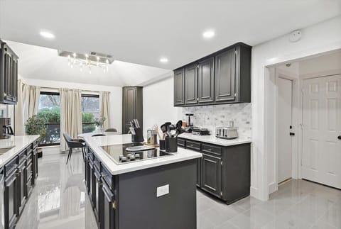 Fully equipped to serve all your cooking needs, this kitchen was designed to allow your culinary dreams to soar with expansive granite countertops and a kitchen island.