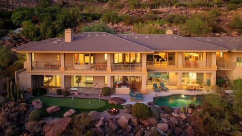 Stunning multi-level home with pool, putting green, and fire pit.