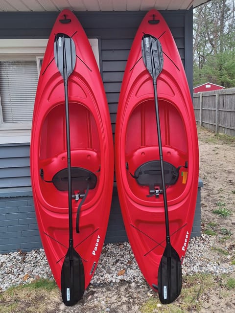 Red kayaks for Torch Lake.