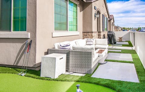 Gather around the fire pit and grill in the outdoor living area.
