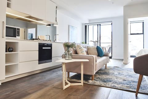 Deluxe Apartment | Living area | 55-inch LED TV with cable channels