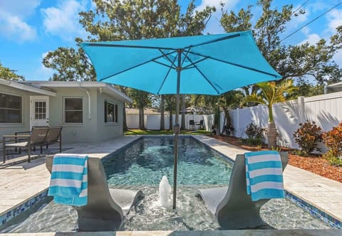 Luxury Ledge Lounger tanning chairs, tanning shelf, fountain and built in umbrella.