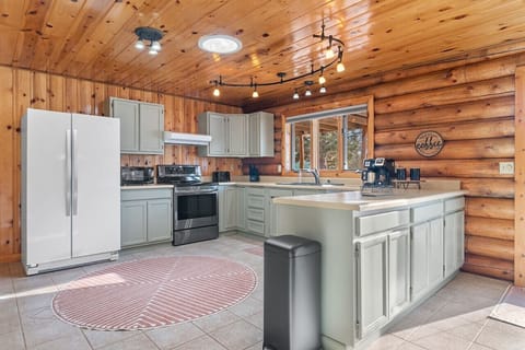 Modern kitchen with stainless steel appliances, ample counter space, and abundant storage, offering a fully-equipped culinary haven for effortless meal preparation.