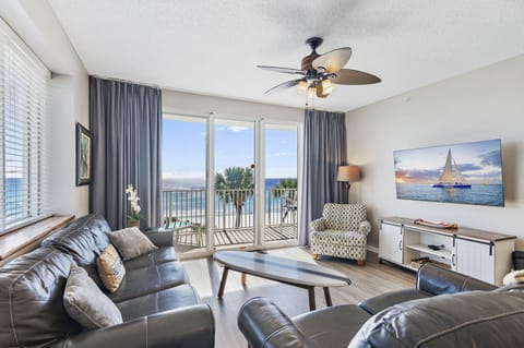 This 3BR/3 BA updated condo features a bright and open living and dining space with tall ceiling, Gulf views, and plenty of seating around a large Smart TV for all your streaming needs.