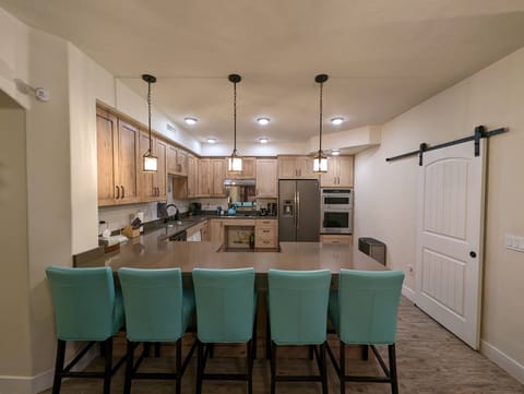 Kitchen and bar with seating for 5