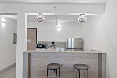 Suite, 1 King Bed with Sofa bed, Balcony | Private kitchen | Highchair