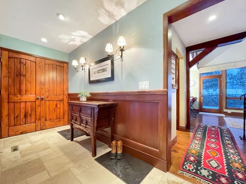 Leaving the first floor master suite, you'll head past the entry into the living area