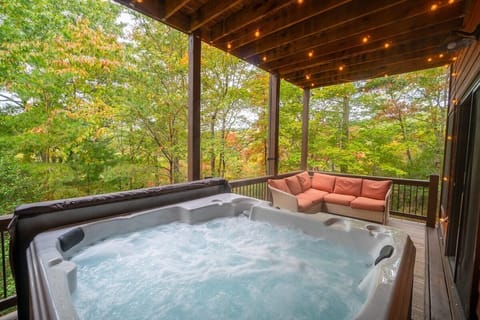 Cozy, private hot tub with lighting and seating area