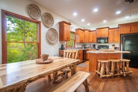 Kitchen with a table that's great for playing games