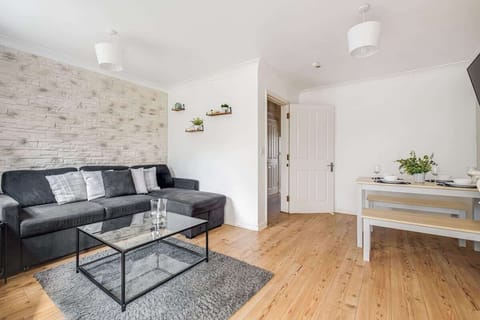 Unwind in the lounge with a plush sofa, the perfect place to relax and watch the large TV