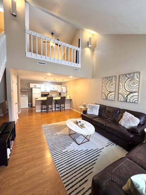Step inside a bright and spacious living room with extra comfy leather couches perfect for relaxing or socializing with friends and family.