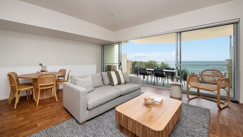 Upstairs living and dining space with balcony access and stunning views