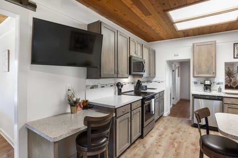 Stay connected and entertained with a smart TV, Wifi Internet access, and a dedicated workstation area!