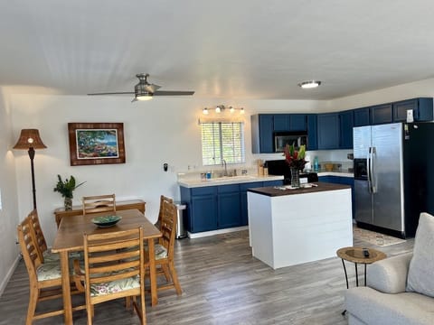 Another view of the dining area and the kitchen