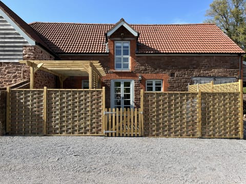 New Willow Hurdle enclosed garden with Pergola and decking