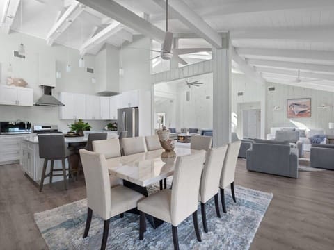 Gorgeous vaulted ceilings and natural light fill this 4/4 home in Chateux Sur Mer