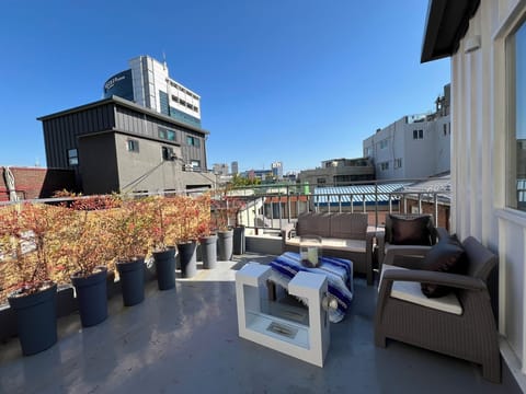 Urban rooftop escape — city views, cozy seating, and sunset vibe