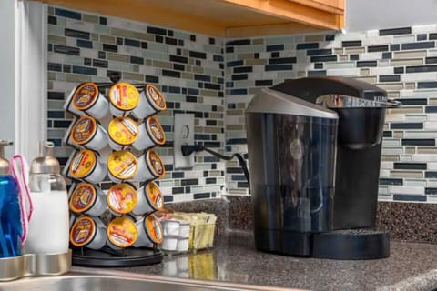 Well‑appointed kitchen stocked with everything you need — Keurig with coffee pods, drip options, double‑basin sink, dishwasher, fridge/freezer, oven, stove, microwave, toaster, and Instapot. Plus, laundry access!