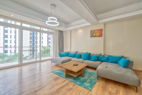 Deluxe Apartment | Living area | Flat-screen TV