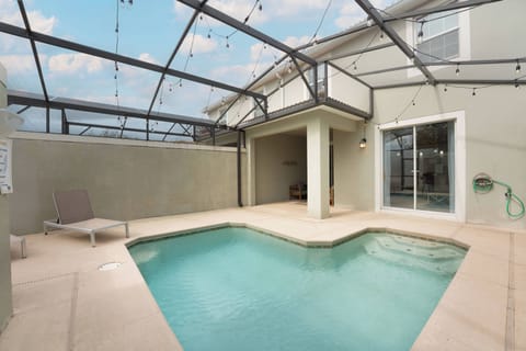 Welcome to your private oasis featuring a sleek pool and spacious deck, perfect for sunbathing or evening gatherings. Enjoy the inviting ambiance of soft lighting and a contemporary design, ideal for ultimate relaxation.