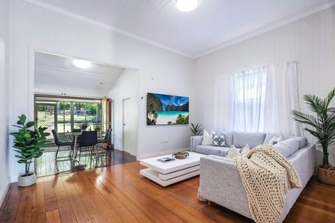 Central Haven Milton lounge with plush sofa, timber floors and 75 inch TV.