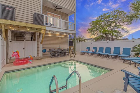 Heated pool with plenty of toys and seating for everyone to get some rays!