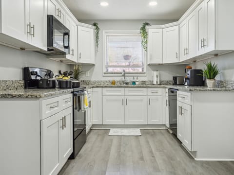 Bright and open fully equipped kitchen where it will be a delight to share meals and moments with family.