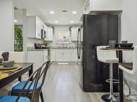 Bright and open fully equipped kitchen where it will be a delight to share meals and moments with family.