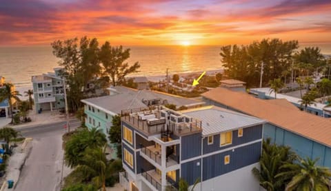 Dreamy sunsets from the rooftop and arrow to show beach access