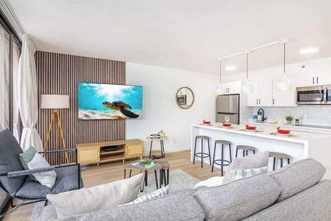 Relax in the living room while watching your favorite shows on our 65" smart TV.