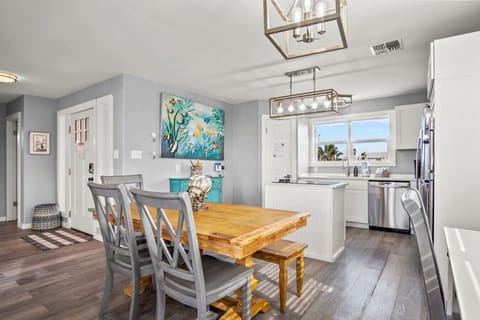 Bright Dining Area with Farmhouse Table and Modern Lighting